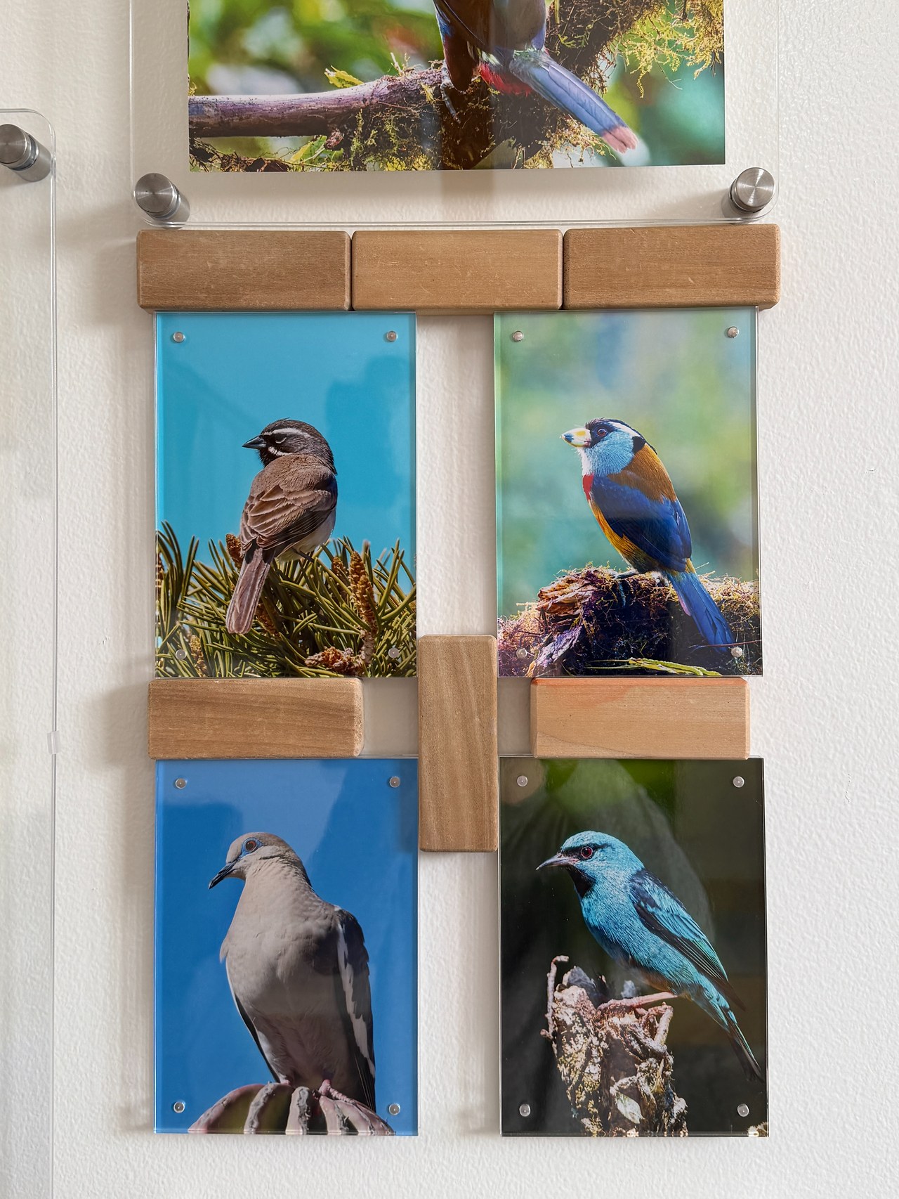 Wooden kids blocks used as 1.5 inch spacers between floating acrylic frames