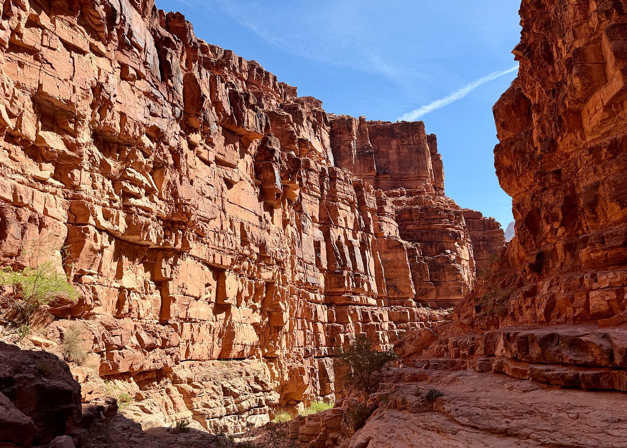 Red canyon walls along the trail