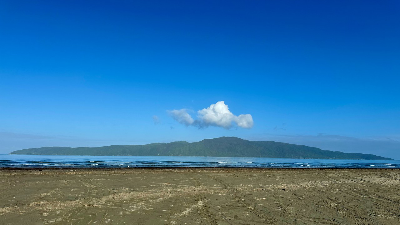 Blue coastal water and shoreline viewed from Kapiti Island.