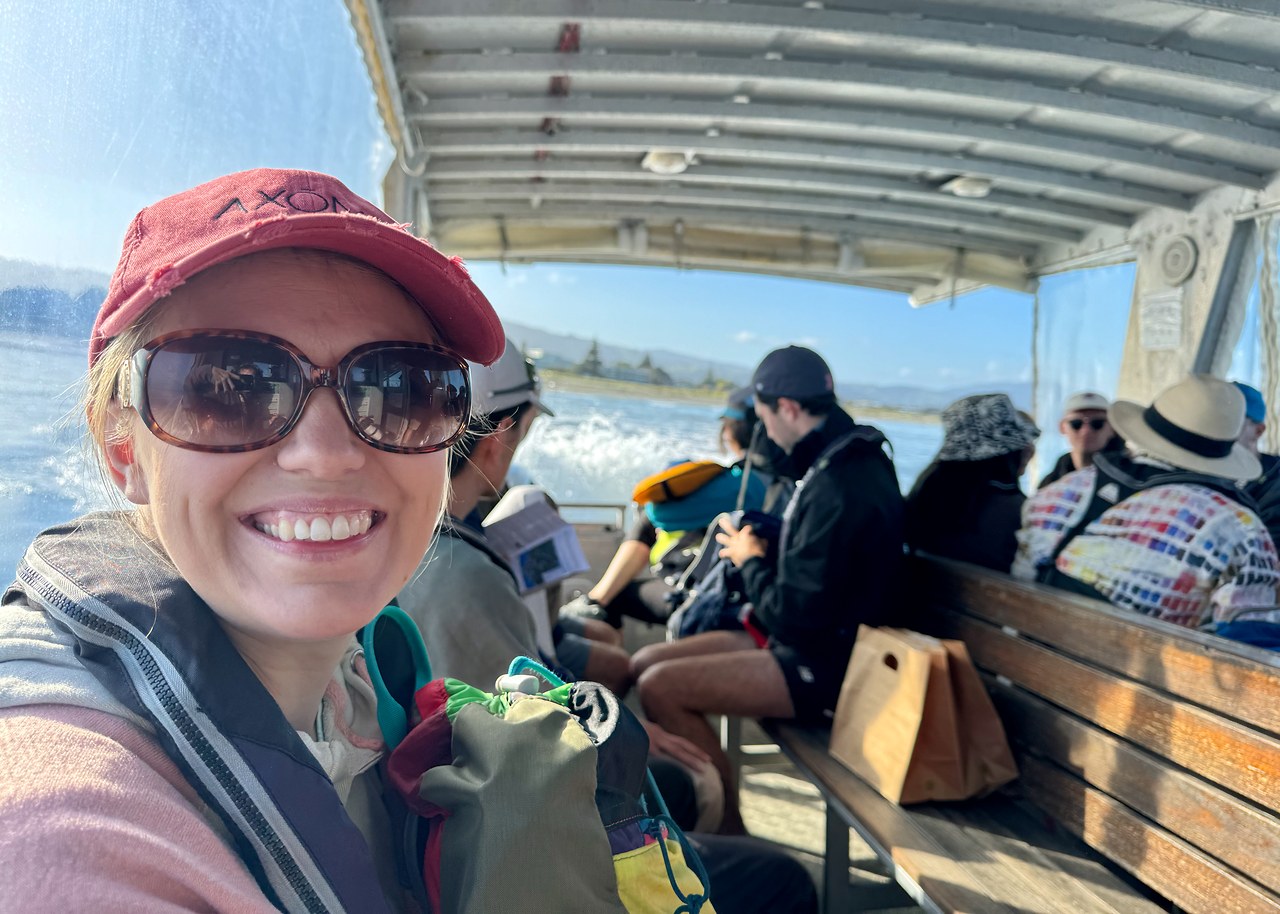 Stacy smiling aboard the ferry to Kapiti Island in New Zealand.