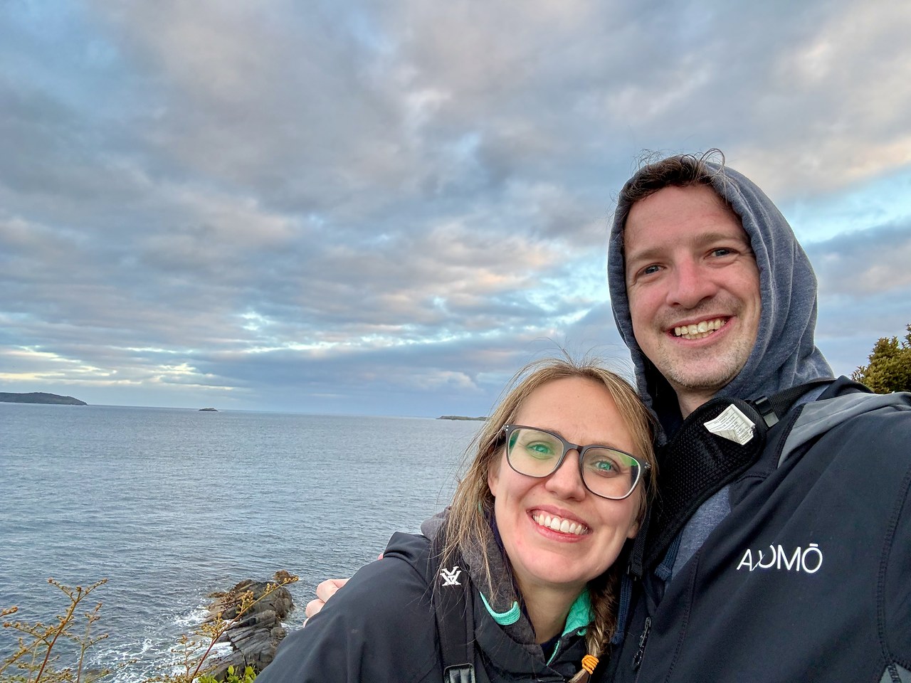 Mike and Stacy bundled up near the Stewart Island coast while waiting for penguins at dusk