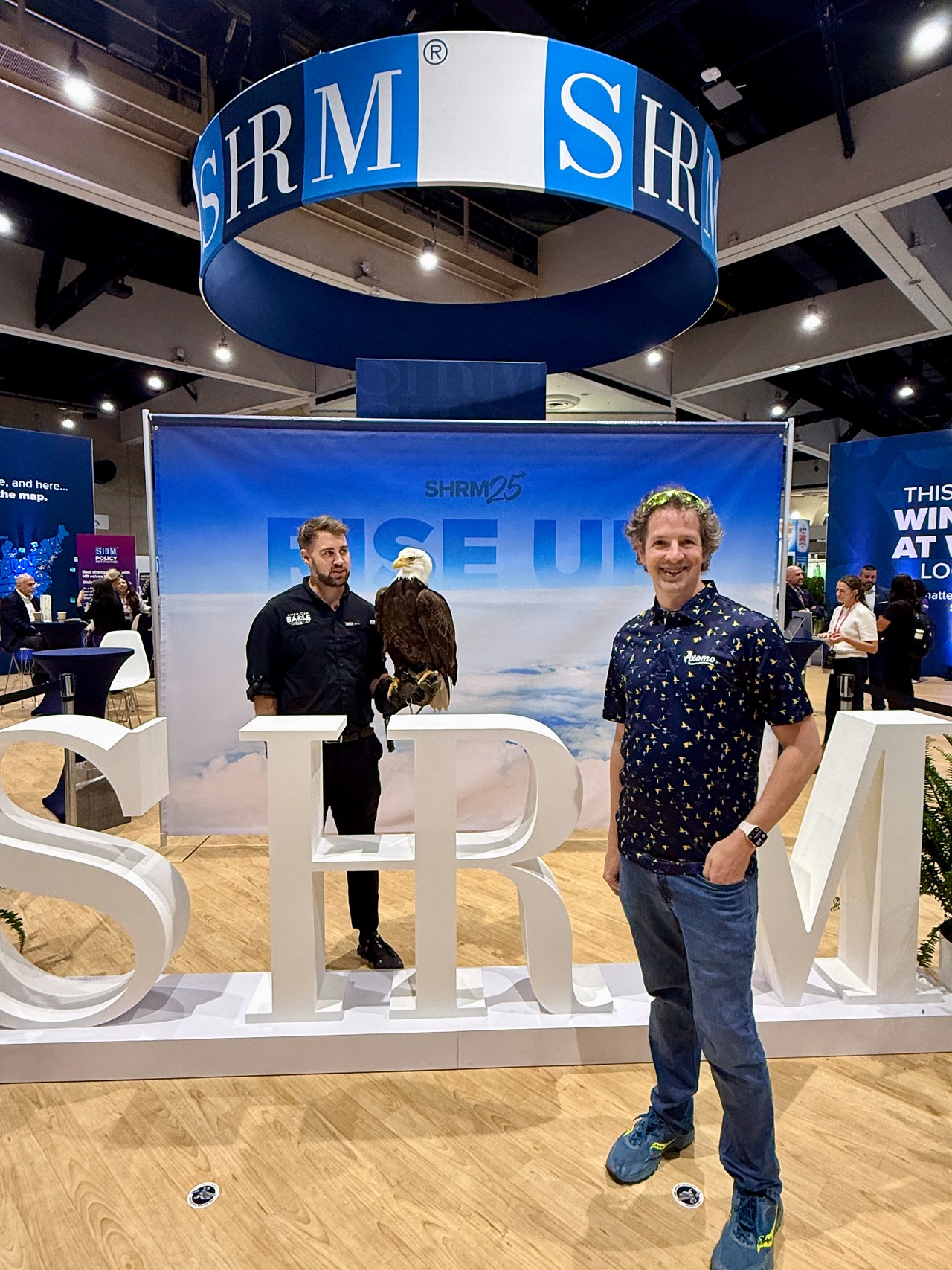 Standing with Lincoln the Bald Eagle on the SHRM expo floor