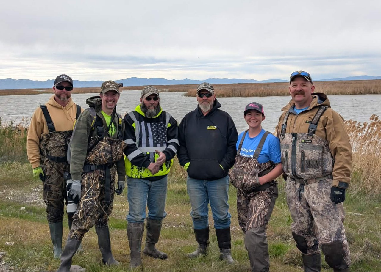 Mike Marshall, Wasatch Wigeons members, Parker Hannifin volunteers, and conservation partners after a marsh habitat restoration project at Willard Bay