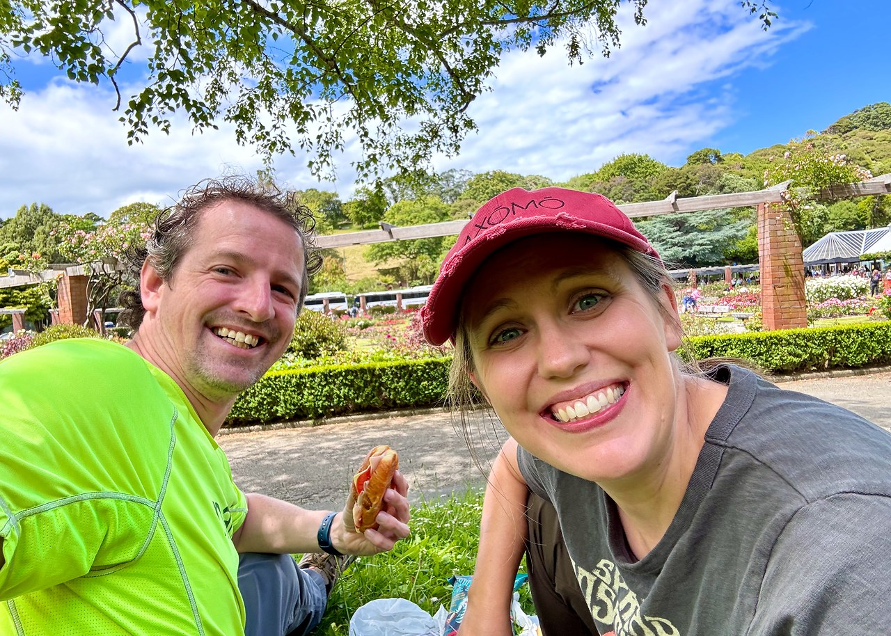 Mike and Stacy enjoying a picnic lunch in the grass at Wellington Botanic Garden.