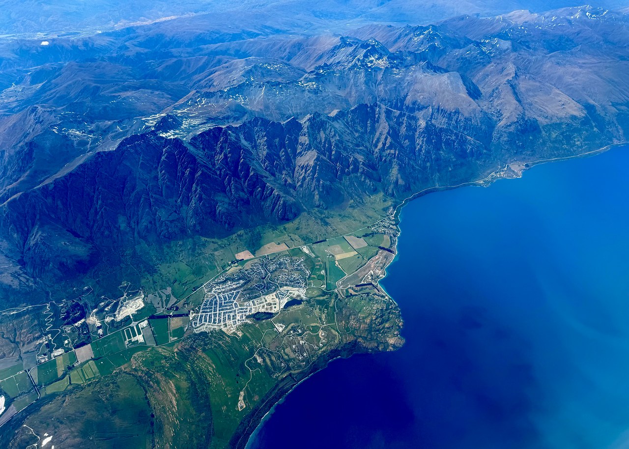 Aerial view of the Southern Alps and blue lakes during a flight from Queenstown to Wellington.