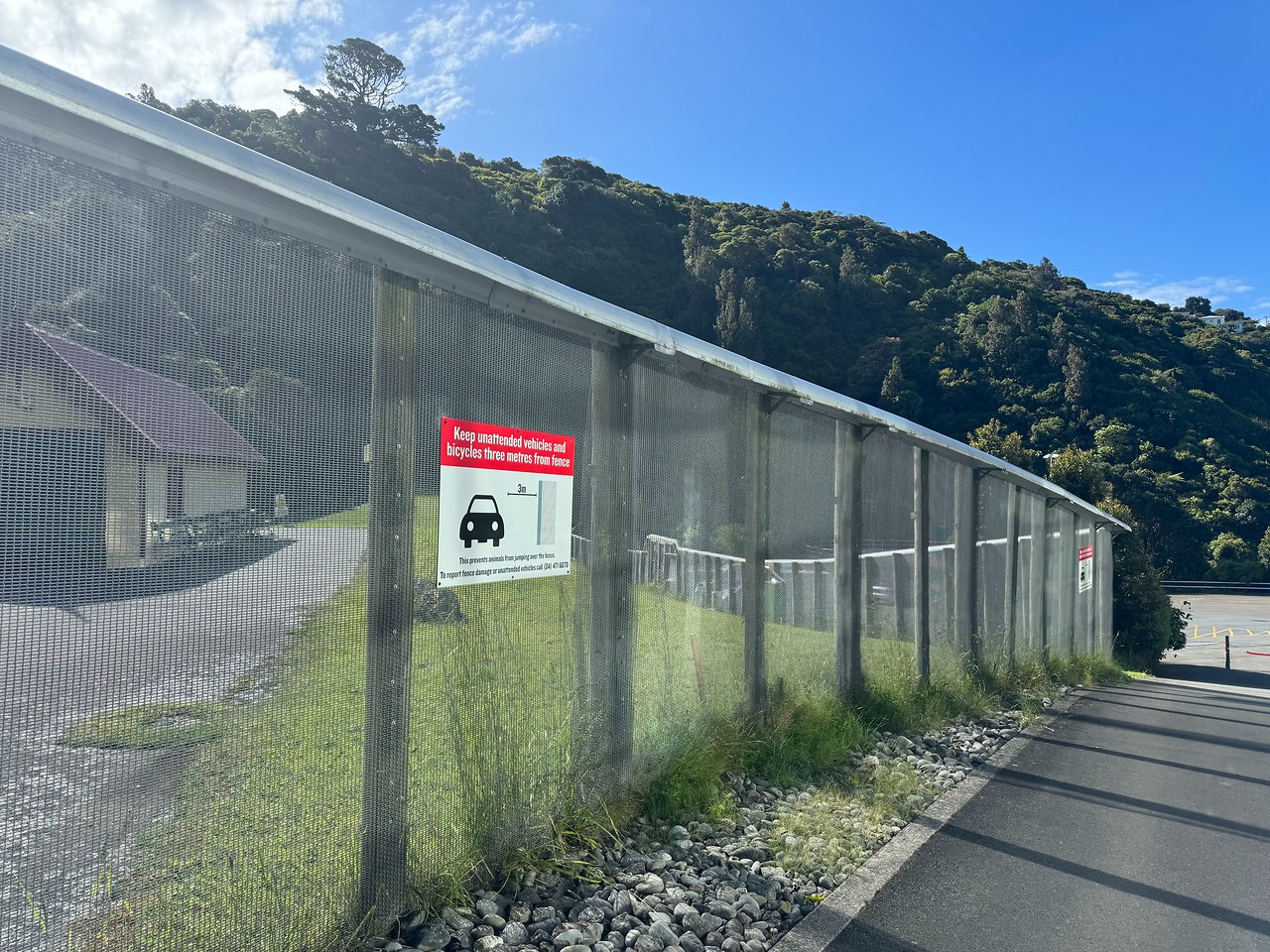Predator-proof fence surrounding Zealandia.